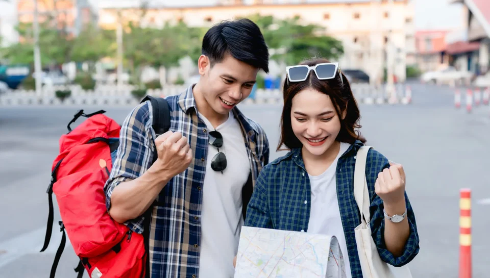 happy-asian-couple-tourist-backpackers-holding-paper-map-looking-direction-while-traveling-they-smile-with-glad-when-arrived-location-paper-map-destination happy-asian-couple-tourist-backpackers-holding-paper-map-looking-direction-while-traveling-they-smile-with-glad-when-arrived-location-paper-map-destination